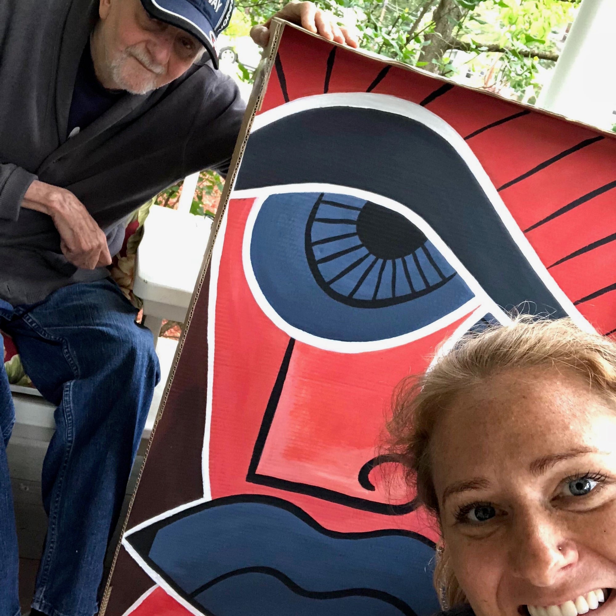 Kristine with her father and his artwork